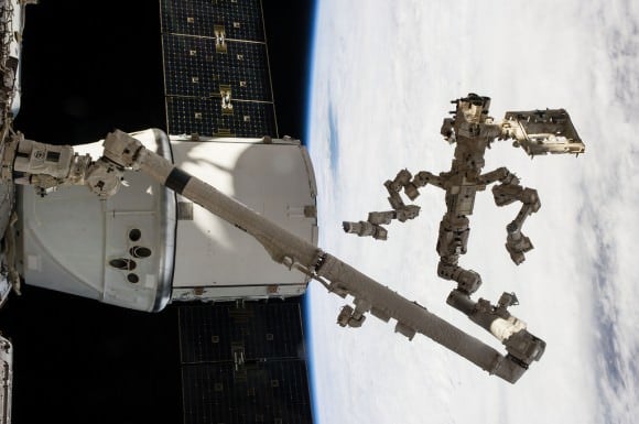 Backdropped against a cloudy portion of Earth, Canada’s Dextre robotic