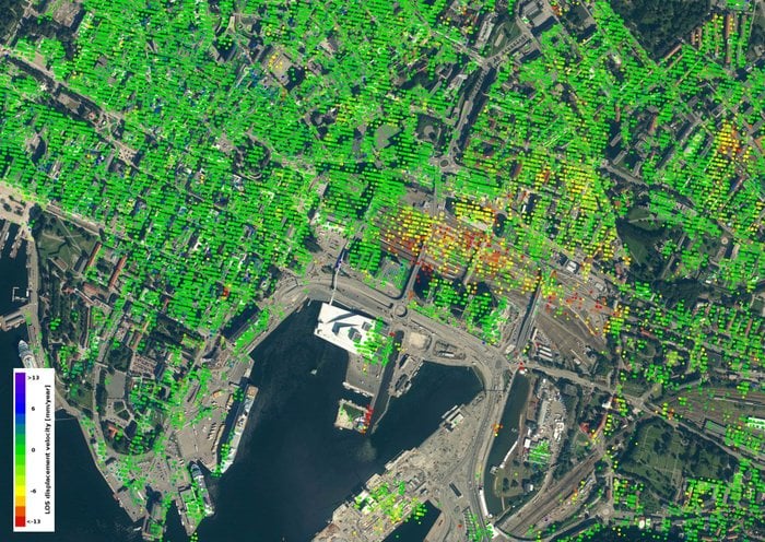 Sentinel-1 data shows that the Oslo train station, the red/yellow area in the center of the image, is sinking at the rate of 12-18mm per year. Image: Copernicus Sentinel data (2014–16) / ESA SEOM INSARAP study / InSAR Norway project / NGU / Norut / PPO.labs
