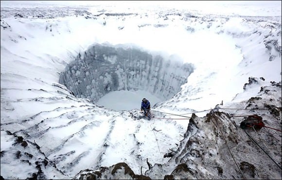 Researchers descend into an ice-covered Yamal Crater in Siberia. Credit: Vladimir Pushkarev/Russian Centre of Arctic Exploration (via Siberian Times)