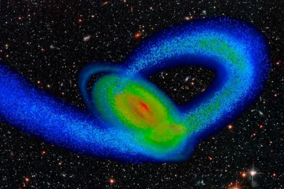 Computer model of the Milky Way and its smaller neighbor, the Sagittarius dwarf galaxy. The flat disk is the Milky Way, and the looping stream of material is made of stars torn from Sagittarius as a result of the strong gravity of our galaxy. The spiral arms began to emerge about two billion years ago, when the Sagittarius galaxy first collided with the Milky Way disk. Image by Tollerud, Purcell and Bullock/UC Irvine