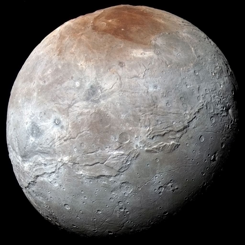 An enhanced-color image of Charon from New Horizons. Image Credit: By NASA/Johns Hopkins University Applied Physics Laboratory/Southwest Research Institute - http://pluto.jhuapl.edu/Multimedia/Science-Photos/image.php?gallery_id=2&image_id=323 (see also http://photojournal.jpl.nasa.gov/catalog/PIA19968), Public Domain, https://commons.wikimedia.org/w/index.php?curid=43899990