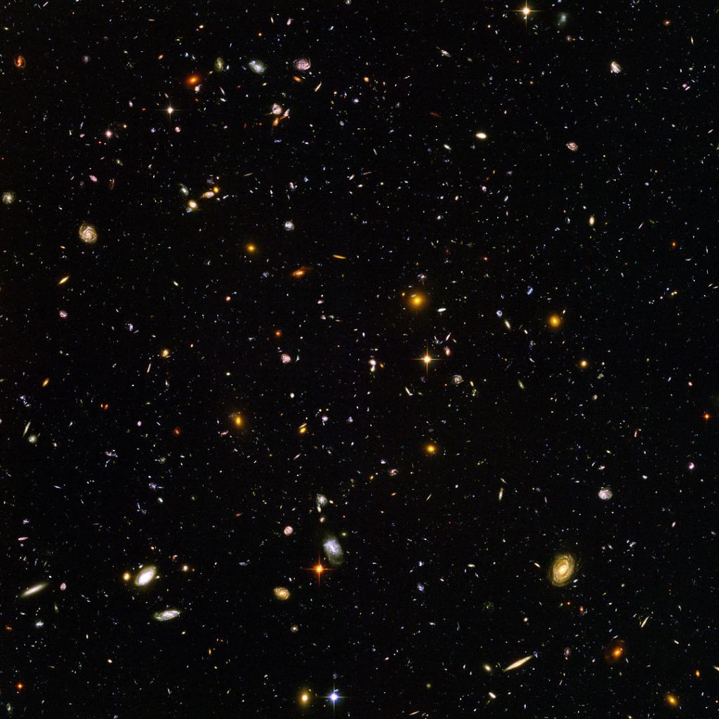 This is the original NASA release of the Hubble Ultra Deep Field. Among all the galaxies in the image are about 10,000 of the most distant galaxies. They're the smallest, reddest ones, and they existed not long after the Big Bang. Image Credit: By NASA and the European Space Agency. Edited by Noodle snacks - http://hubblesite.org/newscenter/archive/releases/2004/07/image/a/warn/, Public Domain, https://commons.wikimedia.org/w/index.php?curid=5276968