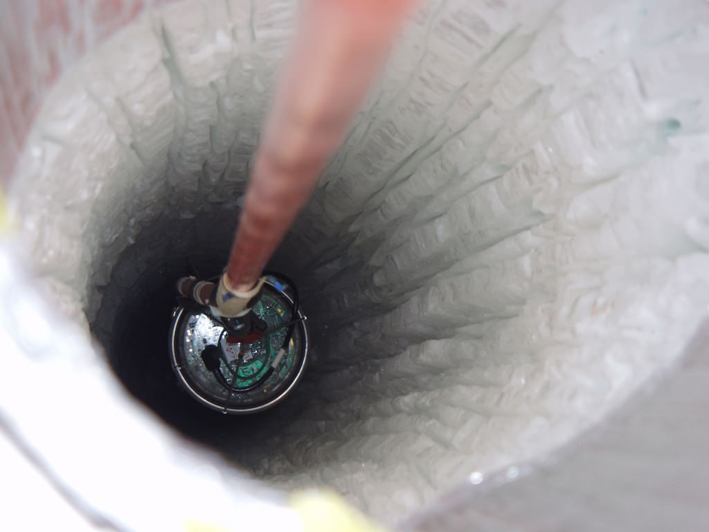 Looking down one of IceCube's detector bore holes.