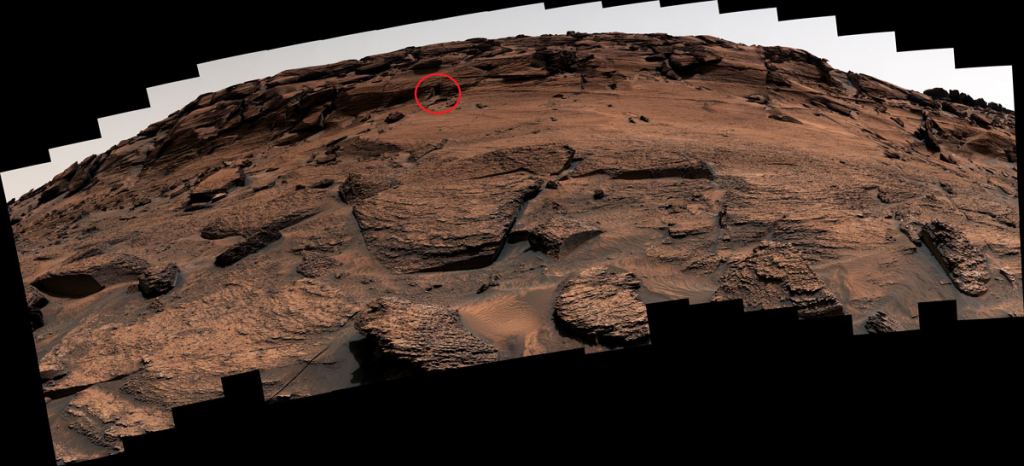 Mars Curiosity rover took a panorama of this rock cliff during its trip across Mount Sharp on Mars. Circled is the location of a so-called