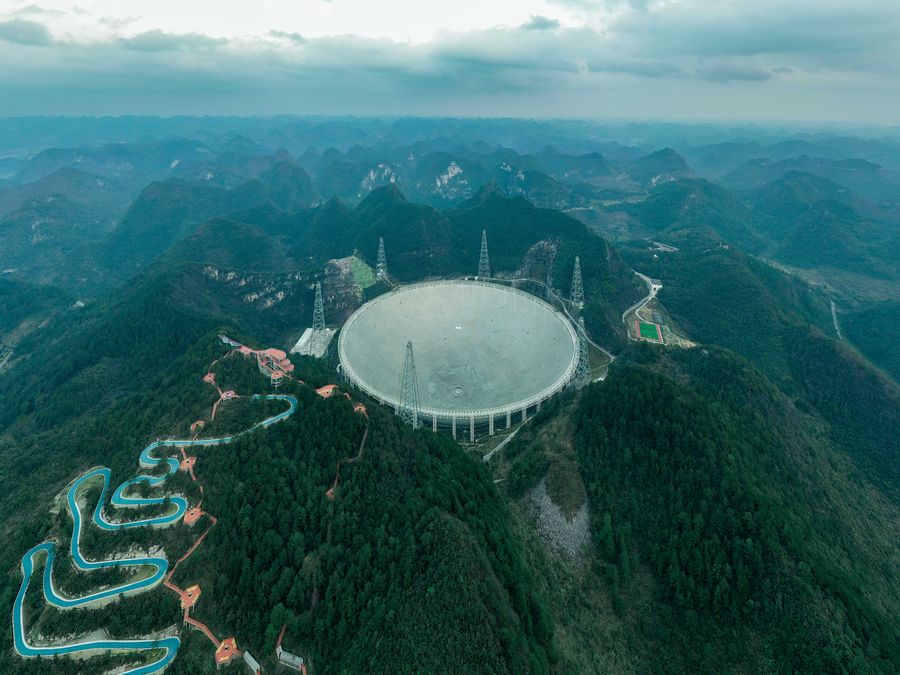 FAST in its home in a natural karst basin in Guizhou, southwest China. Image Credit: Xinhua/Ou Dongqu