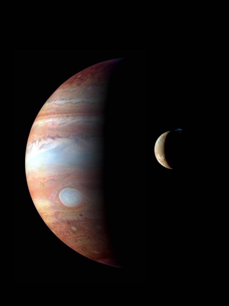 This is image is from the New Horizons spacecraft. It shows Io orbiting Jupiter, with one of Io's many volcanoes erupting. It was captured in 2007 when New Horizons was on its way to Pluto. Image Credit: NASA/Johns Hopkins University Applied Physics Laboratory/Southwest Research Institute/Goddard Space Flight Center