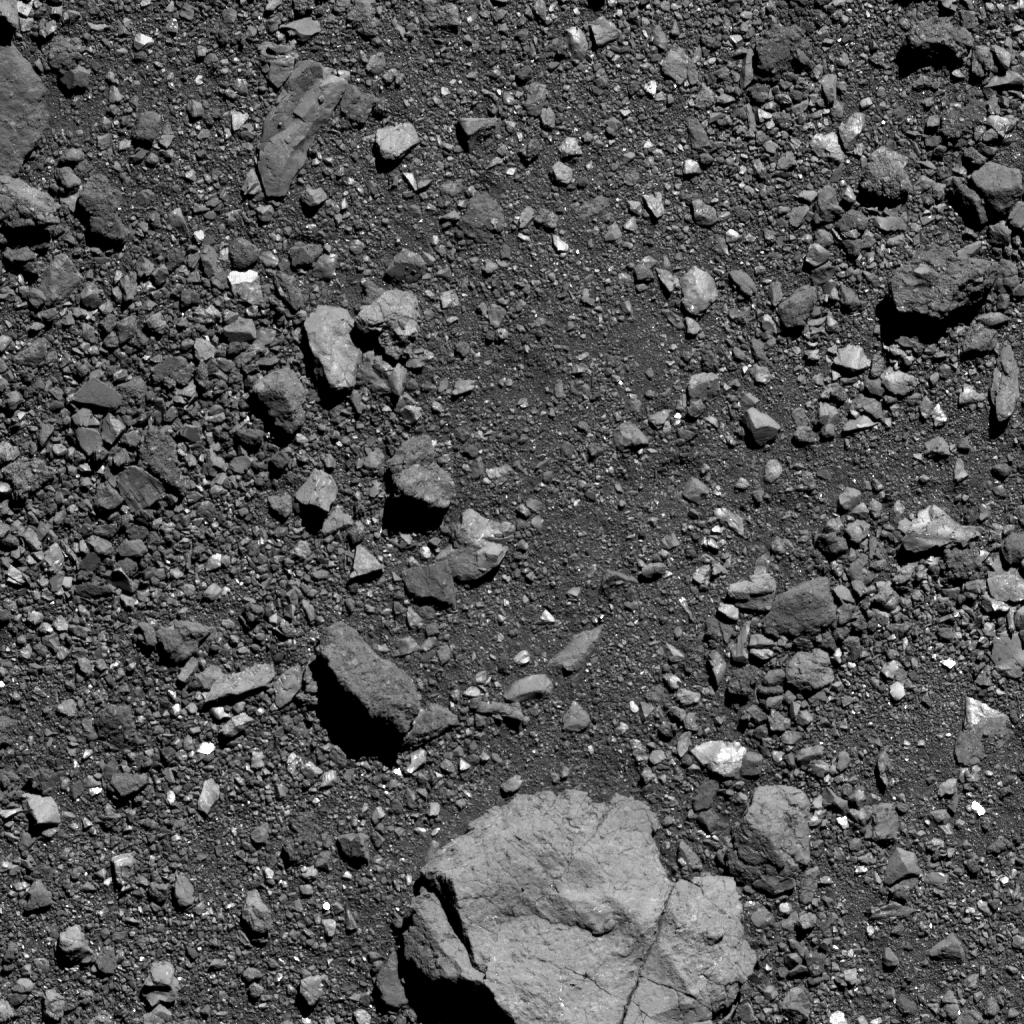This is the highest-resolution image of candidate sample site Sandpiper that’s been captured as of October 5. Site Sandpiper is located in asteroid Bennu’s southern hemisphere, and the region of interest is visible in the center of the image (situated above the large boulder). The image was taken by the PolyCam camera on NASA’s OSIRIS-REx spacecraft on October 5, from a distance of 0.6 miles (1 km). The field of view is 48 ft (14.6 m). For scale, the large, light colored boulder in the bottom center of the image is 16 ft (5 m) wide, which is about the size of a box truck. For scale, the large, light colored boulder in the bottom center of the image is 16 ft (5 m) wide, which is about the size of a box truck. Image Credit: NASA/Goddard/University of Arizona