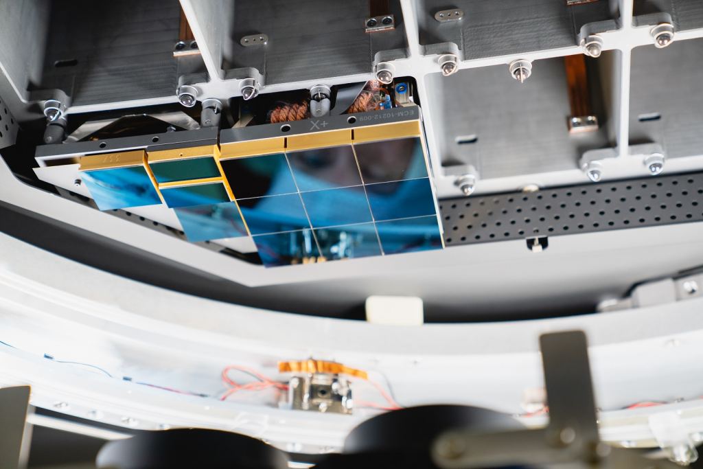 The Large Synoptic Survey Telescope (LSST) camera team has installed the first of 21 science rafts -- 3-by-3 arrays of state-of-the-art imaging sensors. This image shows one of the 3-by-3 image capturing arrays, and one of the smaller aiming and synchronizing arrays. Together the imaging system will take unprecedented 3,200-megapixel images of the night sky, which, over time, will produce the world's largest astrophysical movie. Photo: Farrin Abbott / SLAC