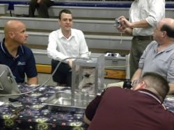 Ted Southern watches his glove as it is subjected to the burst test. Image Credit: NASA