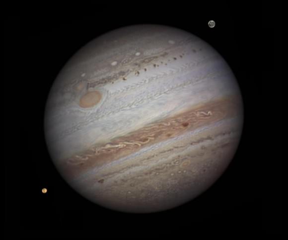 Jupiter with Io and Ganymede taken by amateur astronomer Damian Peach. Credit: NASA / Damian Peach