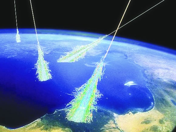 Artist's impression of cosmic rays striking Earth and the resulting shower of particles. Image Credit: Simon Swordy/University of Chicago, NASA