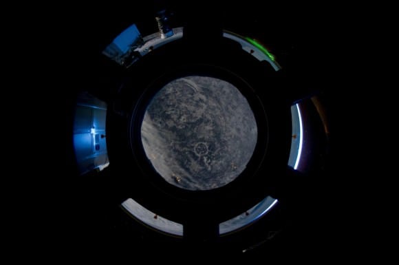 The Cupola provides a portal to 215 million years in the past: The Manicouagan impact crater in northern Québec shows up nearly in the center of the main Cupola window. Credit: NASA