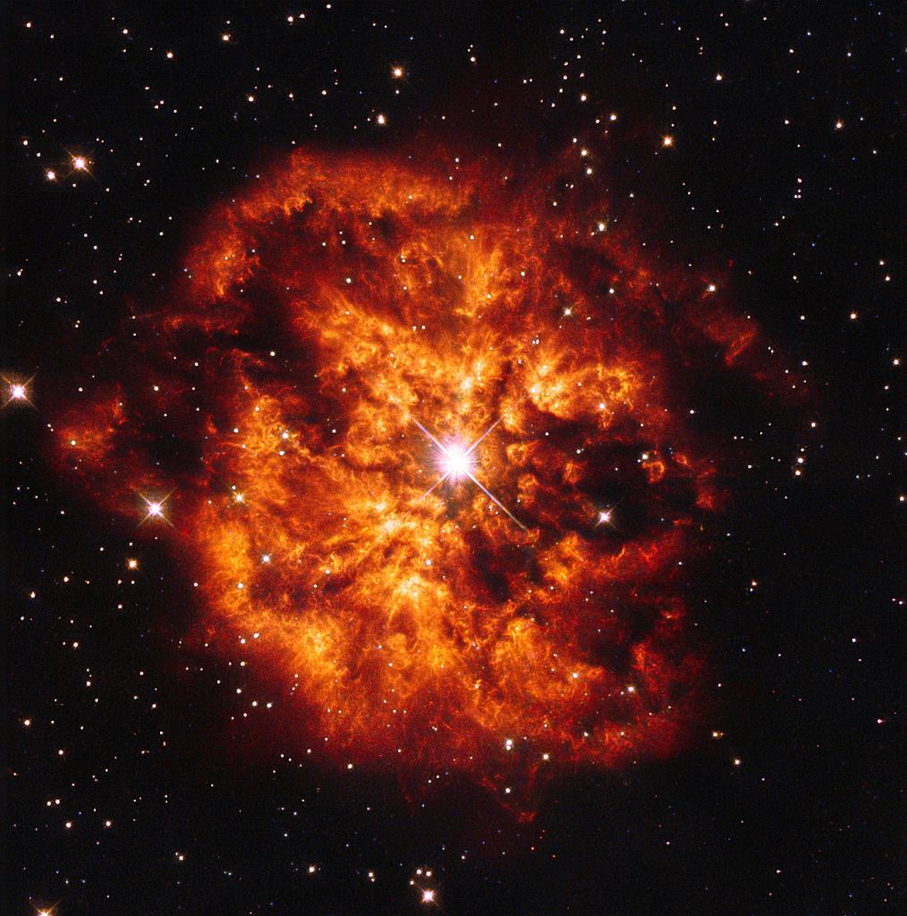 This Hubble Space Telescope image shows the spectacular cosmic pairing of the star Hen 2-427 — more commonly known as WR 124 — and the nebula M1-67 which surrounds it. WR 124 shines brightly at the very centre of this explosive image, and around it, the hot clumps of gas are ejected into space at over 150,000 kilometres per hour. Wolf–Rayet stars are super-hot stars characterized by a fierce ejection of mass. Image Credit: By Judy Schmidt - Own work, CC0, https://commons.wikimedia.org/w/index.php?curid=28186676