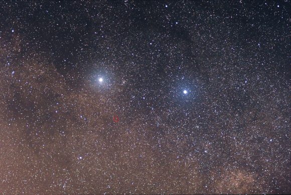The two bright stars are (left) Alpha Centauri and (right) Beta Centauri. The faint red star in the center of the red circle is Proxima Centauri. Credit: Skatebiker at English Wikipedia (CC BY-SA 3.0)