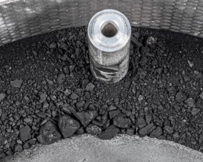 The sample material includes dust and rocks up to about .4 in (one cm) in size. Credit: NASA/Erika Blumenfeld & Joseph Aebersold