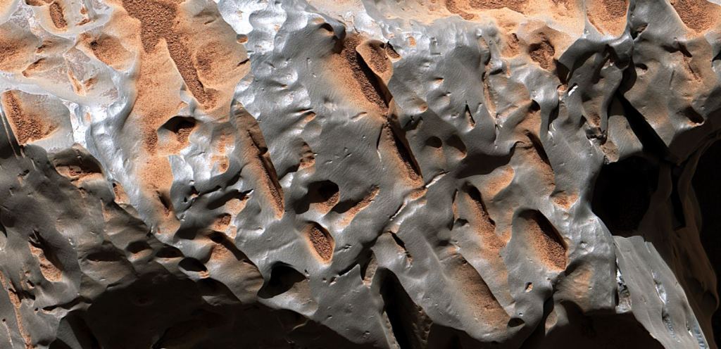 Zooming into Cacao's fascinating pits and ridges. Image Credit: NASA/JPL-Caltech/MSSS