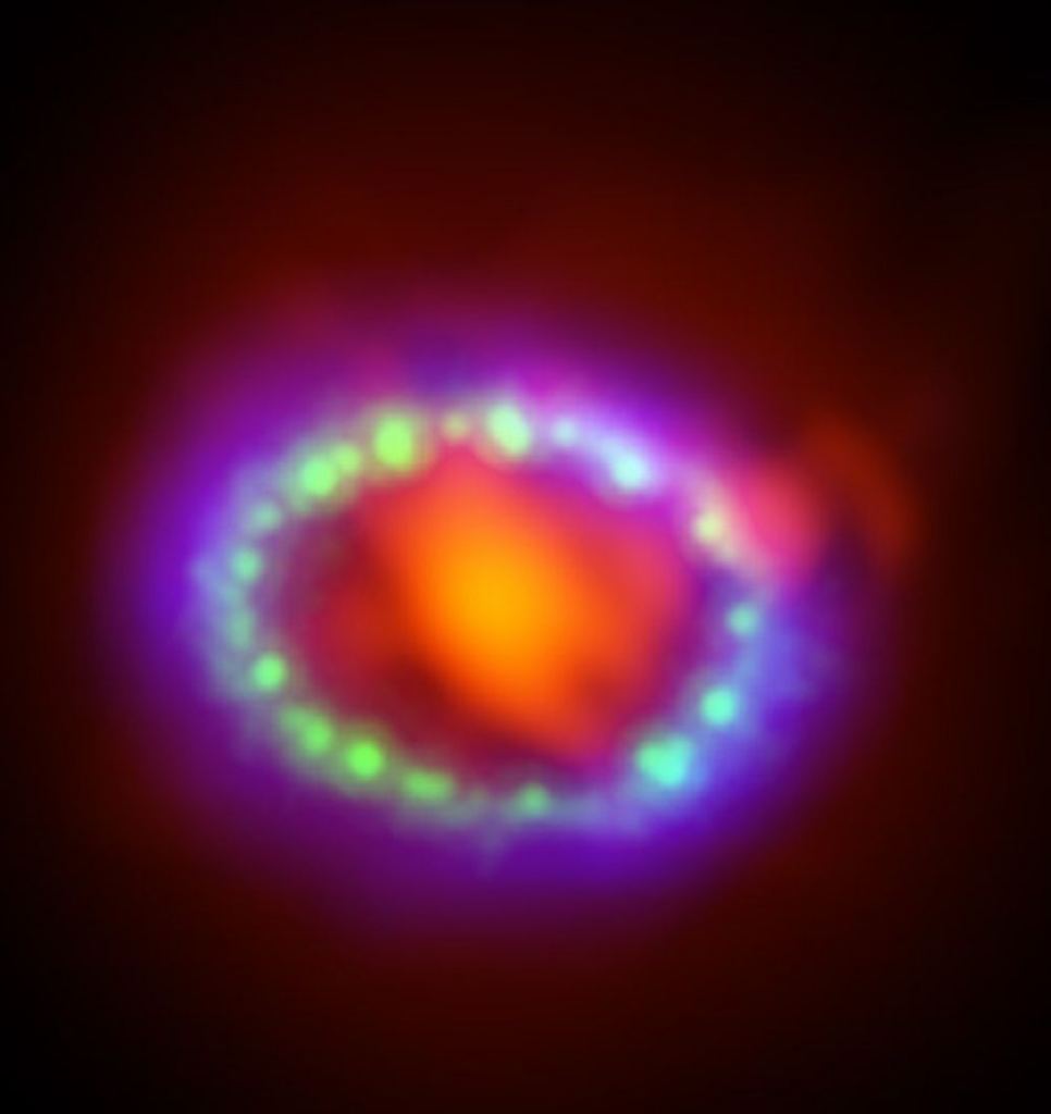 Supernovae explosions are spectacular cosmic light shows, as long as they're not too close. This is a composite image of SN 1987A from Hubble, Chandra, and ALMA. Image Credit: By ALMA (ESO/NAOJ/NRAO)/A. Angelich. Visible light image: the NASA/ESA Hubble Space Telescope. X-Ray image: The NASA Chandra X-Ray Observatory - http://www.eso.org/public/images/eso1401a/, CC BY 4.0, https://commons.wikimedia.org/w/index.php?curid=30512379