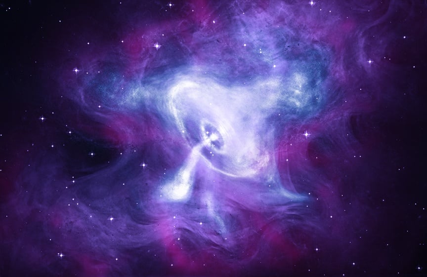 This composite image of the Crab Nebula features X-rays from Chandra (blue and white), optical data from Hubble (purple), and infrared data from Spitzer (pink). Chandra has repeatedly observed the Crab since the telescope was launched into space in 1999. Image Credit: X-ray: NASA/CXC/SAO; Optical: NASA/STScI; Infrared: NASA-JPL-Caltech