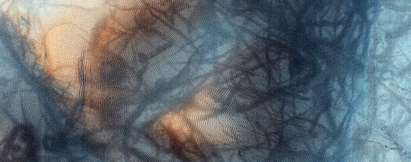 More dust-devils on the surface of Mars. The visual interplay between the dust devil tracks and the wind-driven dunes is beautiful. Image Credit: NASA/JPL/University of Arizona.