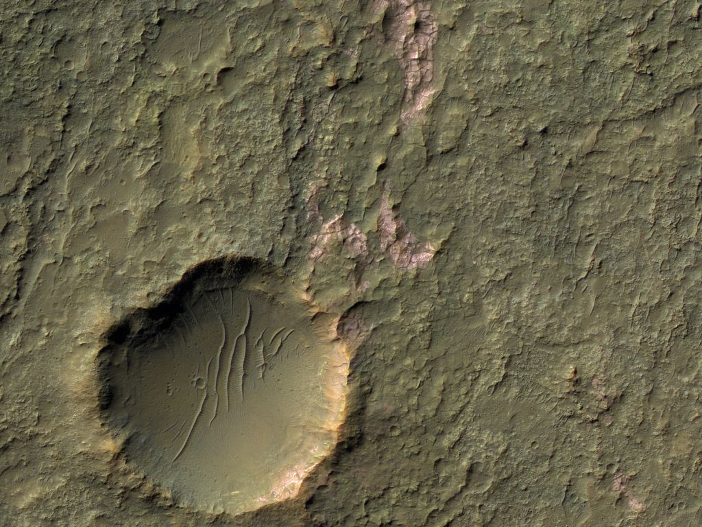 Craters figure prominently in HiRISE's Picture of the Day archive. This one is the POD for September 5th, 2020. It was taken on January 19th, 2012. It shows a small crater on Mars, with dunes inside it, and pink patches of chloride salts. Image Credit: NASA/JPL/UArizona