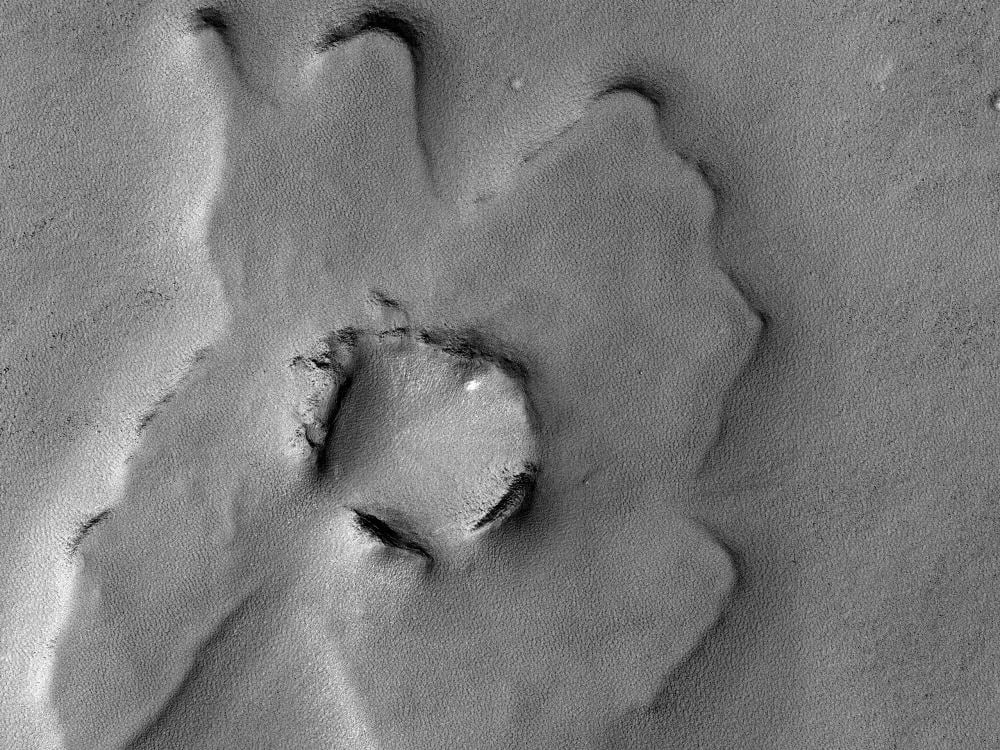 Over time, all craters erode away. This one is pretty old, and its rim has eroded away in several spots. Image Credit: NASA/JPL/UofArizona
