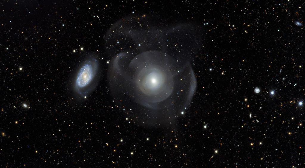 This image from the Dark Energy Survey (DES) shows galaxy NGC 474 with the nearby spiral NGC 470. The Hubble image zeroed in on the central region of the elliptical. Credit: DES/DOE/Fermilab/NCSA & CTIO/NOIRLab/NSF/AURA Acknowledgments: Image processing: DES, Jen Miller (Gemini Observatory/NSF's NOIRLab), Travis Rector (University of Alaska Anchorage), Mahdi Zamani & Davide de Martin