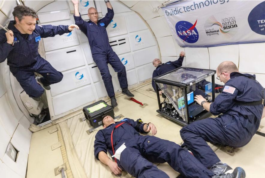 FLUTE researchers experience microgravity aboard Zero Gravity Corporation's G-FORCE ONE aircraft while operating an experiment payload during a series of parabolic flights. Image Credits: Zero Gravity Corporation/Steve Boxall