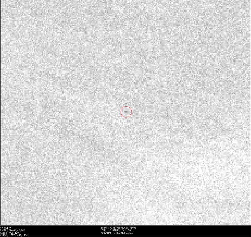 This was what the astronomers had to find. The dot in the middle of the red circle is 2021 QM1.