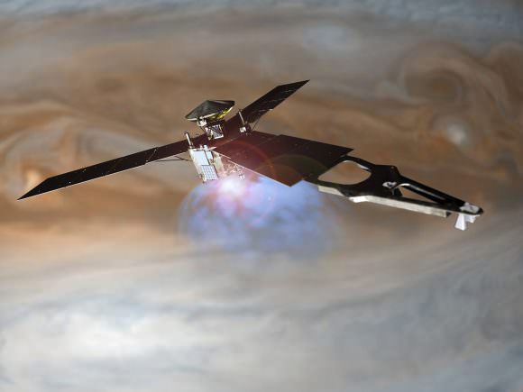 Illustration of NASA's Juno spacecraft firing its main engine to slow down and go into orbit around Jupiter. Lockheed Martin built the Juno spacecraft for NASA's Jet Propulsion Laboratory. Credit: NASA/Lockheed Martin