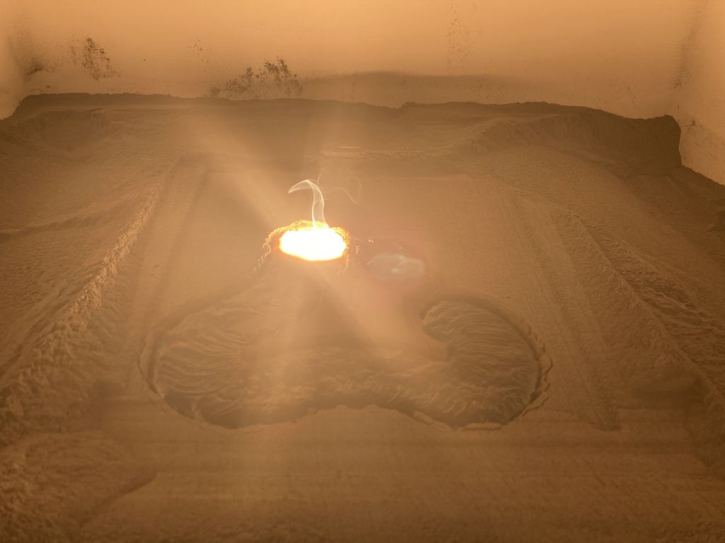 The PAVER consortium made use of a 12-kilowatt carbon dioxide laser to melt simulated moondust into a glassy solid surface as a way of constructing paved surfaces on the face of the Moon. They melted 20 cm. triangular sections that can be interlocked to form a solid surface. Image Credit: PAVER Consortium.