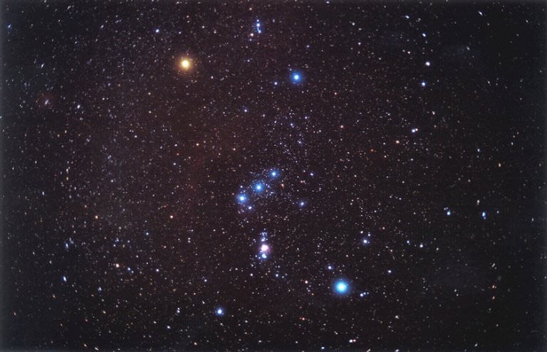Massive stars are comparatively rare, but we can still see them in the night sky. This image is of the constellation Orion, and the massive star Rigel is the bright blue star in the lower right corner. It's about 21 solar masses, and is young; only about 8 million years old. It will eventually explode as a supernova, but not for a long time. Credit: NASA Astronomy Picture of the Day Collection NASA