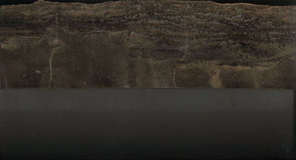 This slab of rock from Southern China shows the Permian-Triassic boundary. The bottom is pre-extinction limestone and the top is microbial limestone deposited after the Earth's worst extinction. Image Credit: Jonathan Payne/Stanford University