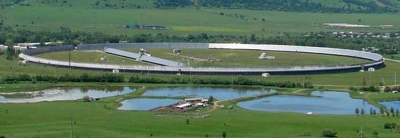 Russia's RATAN-600 radio telescope. It consists of a 600 meter diameter ring of reflectors which focuses radio waves onto a single conical feed antenna in the center. Image Credit: By ????????? ? ??????? - File:RATAN 600.jpg, CC BY 3.0, https://commons.wikimedia.org/w/index.php?curid=38674396
