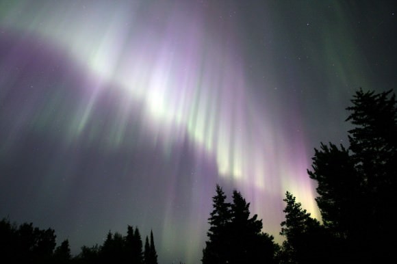 A massive wall of bright purple and green rays from July 20, 2012. Details: 16mm at f/2.8, ISO 800 and 20 second exposure. Credit: Bob King