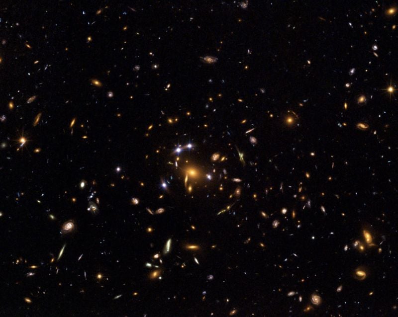 A Hubble Space Telescope image of quasar lensed by galaxy cluster SDSS J1004+4112. It was discovered as part of the Sloan Digital Sky Survey and is about 7 billion light years away. Image Credit: European Space Agency, NASA, Keren Sharon (Tel-Aviv University) and Eran Ofek (CalTech)