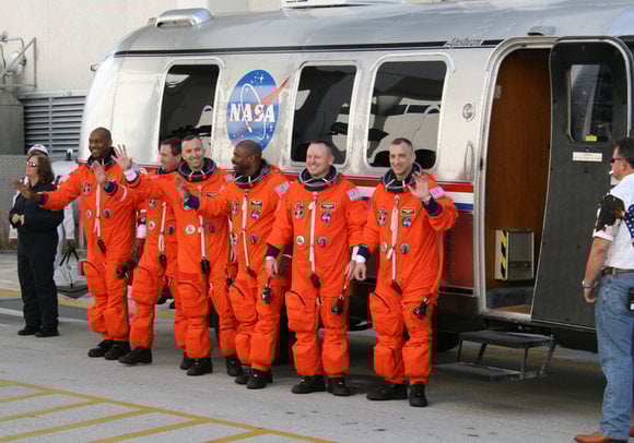The six person crew of Space Shuttle Atlantis walk out from crew quarters at 10:38 AM to greet the cheering crowd of media and NASA officials and then head out to pad 39 A to strap in for space launch with hours. Credit: Ken Kremer