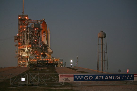 The protective Rotating Service Structure is about halfway through its 25 minute long rollback at dusk on 15 November 2009 to expose Atlantis for launch at Kennedy Space Center Pad 39 A. Credit: Ken Kremer