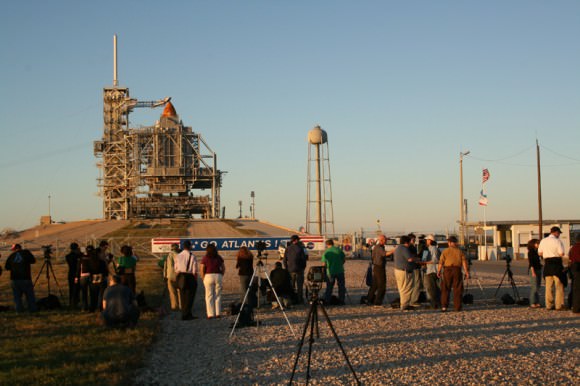 Media from around the globe have descended on the Kennedy Space Center press site to report on STS 129. I met journalists from many countries including India, Australia, Japan, Korea, Slovenia, Poland, Netherlands, Germany, Turkey, United States and more. RSS rollback has just commenced as we stand at the perimeter security fence surrounding Pad 39 A. Credit: Ken Kremer