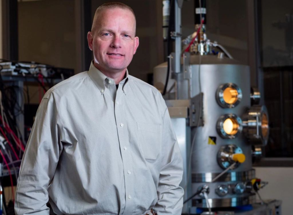 Hanspeter Schaub in his lab with the ECLIPS facility in the background. Image Credit: Patrick Campbell/CU Boulder