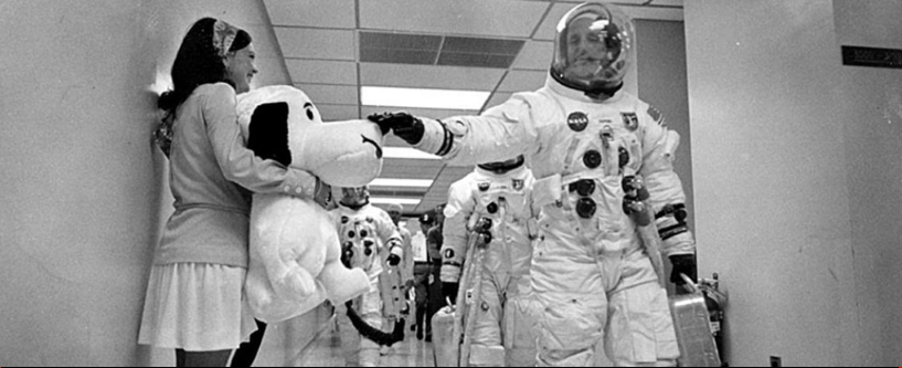 Apollo 10 commander Thomas Stafford pats a stuffed Snoopy on the snout as he heads to the launch. Image Credit: NASA.