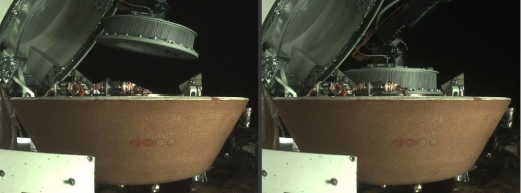 This image shows OSIRIS-REx placing its sampling head inside the Sample Return Capsule. The initial science results are from extra material on the outside of the sampling head. The primary sample hasn't been examined yet. Image Credit: NASA/Goddard/University of Arizona/Lockheed Martin.
