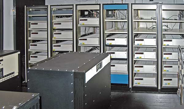 Atomic clocks have been in use for decades. This image shows banks of atomic clocks at the US Naval Observatory, used to define the time standard for the US Dept. of Defense. Image: By US Naval Observatory - http://tycho.usno.navy.mil/gif/clockvaults.jpg, Public Domain, https://commons.wikimedia.org/w/index.php?curid=5538835