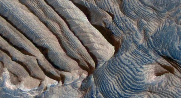 Rhythmic bedding in sedimentary bedrock within Becquerel crater on Mars is suggested by the patterns in this image from NASA's Mars Reconnaissance Orbiter. Image credit: Image credit: NASA/JPL-Caltech/University of Arizona