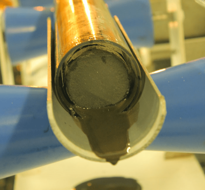 Scientists look for signs of life in cores like this one. The cores on International Ocean Discovery Program's (IODP) Expedition 337 were taken to depths down to 2.5 km below the seafloor, where temperature increases from 30°C to 60°C, spanning the predicted temperature limit for life on Earth. Image courtesy of Luc Riolon/JAMSTEC