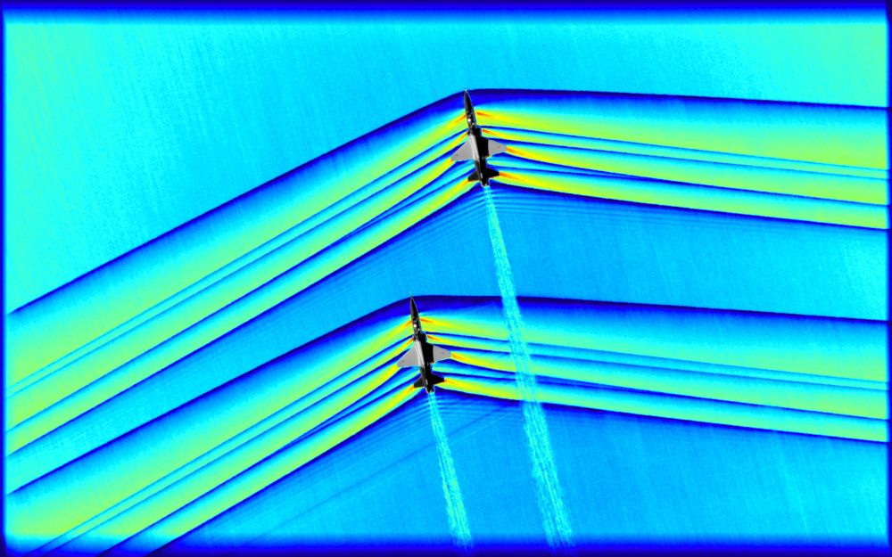 One of the greatest challenges of the flight series was timing. In order to acquire this image, originally monochromatic and shown here as a colorized composite image, NASA flew a B-200, outfitted with an updated imaging system, at around 30,000 feet while the pair of T-38s were required to not only remain in formation, but to fly at supersonic speeds at the precise moment they were directly beneath the B-200. The images were captured as a result of all three aircraft being in the exact right place at the exact right time designated by NASA’s operations team.
Credits: NASA Photo