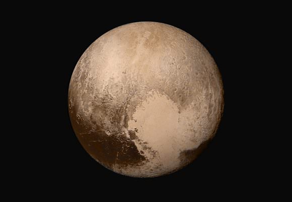 Four images from New Horizons’ Long Range Reconnaissance Imager (LORRI) were combined with color data from the Ralph instrument to create this global view of Pluto. Credits: NASA/JHUAPL/SwRI