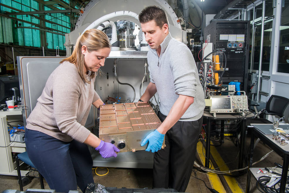 The power processing unit of the thruster is removed from another vacuum chamber after successful testing.
Credits: NASA/Bridget Caswell