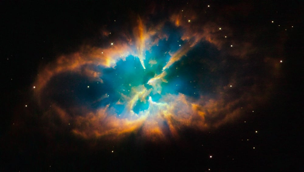 Planetary nebula NGC 2818 is nested inside the open star cluster NGC 2818A. This planetary nebula is not part of this study. Credit: NASA, ESA, and the Hubble Heritage Team (STScI/AURA)
