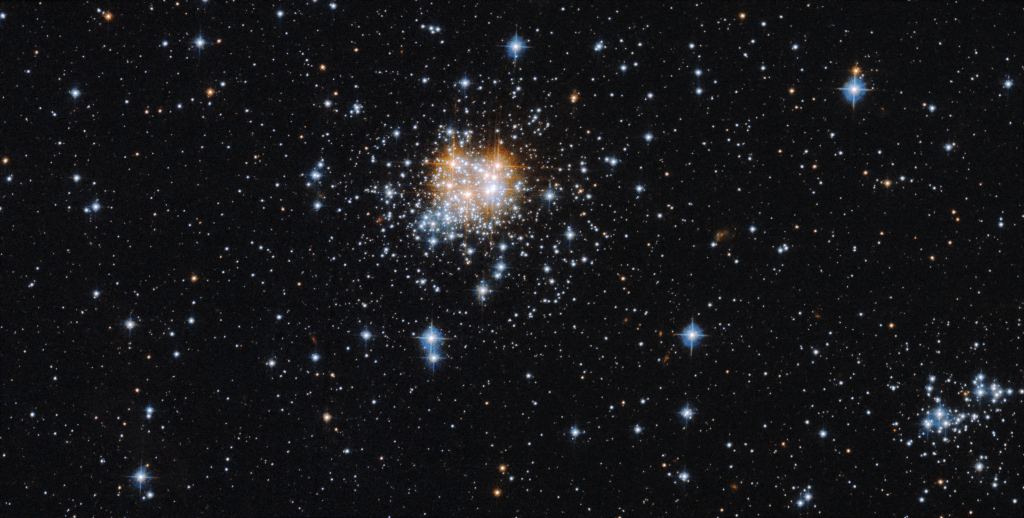 A twinkling group of stars dominates the center of the open cluster NGC 2002 in this Hubble image. Image Credit: NASA, ESA and G. Gilmore (University of Cambridge); Processing: Gladys Kober (NASA/Catholic University of America)