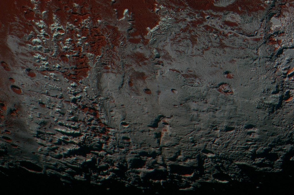 This area is south of Pluto's dark equatorial band informally named Cthulhu Regio, and southwest of the vast nitrogen ice plains informally named Sputnik Planitia. North is at the top; in the western portion of the image, a chain of bright mountains extends north into Cthulhu Regio. New Horizons compositional data indicate the bright snowcap material covering these mountains isn't water, but atmospheric methane that has condensed as frost onto these surfaces at high elevation. Credit: NASA/Johns Hopkins University Applied Physics Laboratory/Southwest Research Institute.